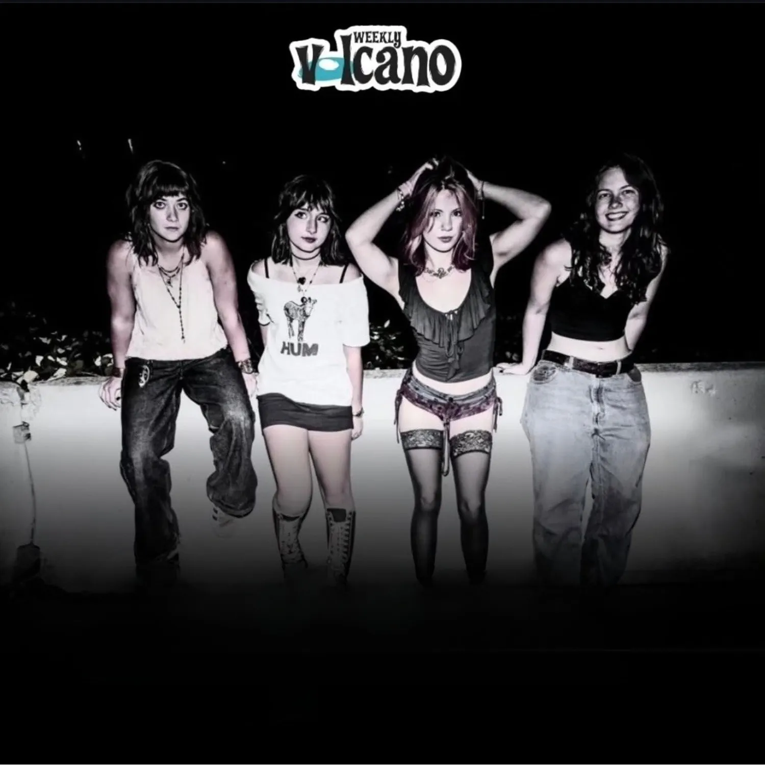 The four members of Chewing Gum posed against a low wall at night, with the Weekly Volcano logo above them.